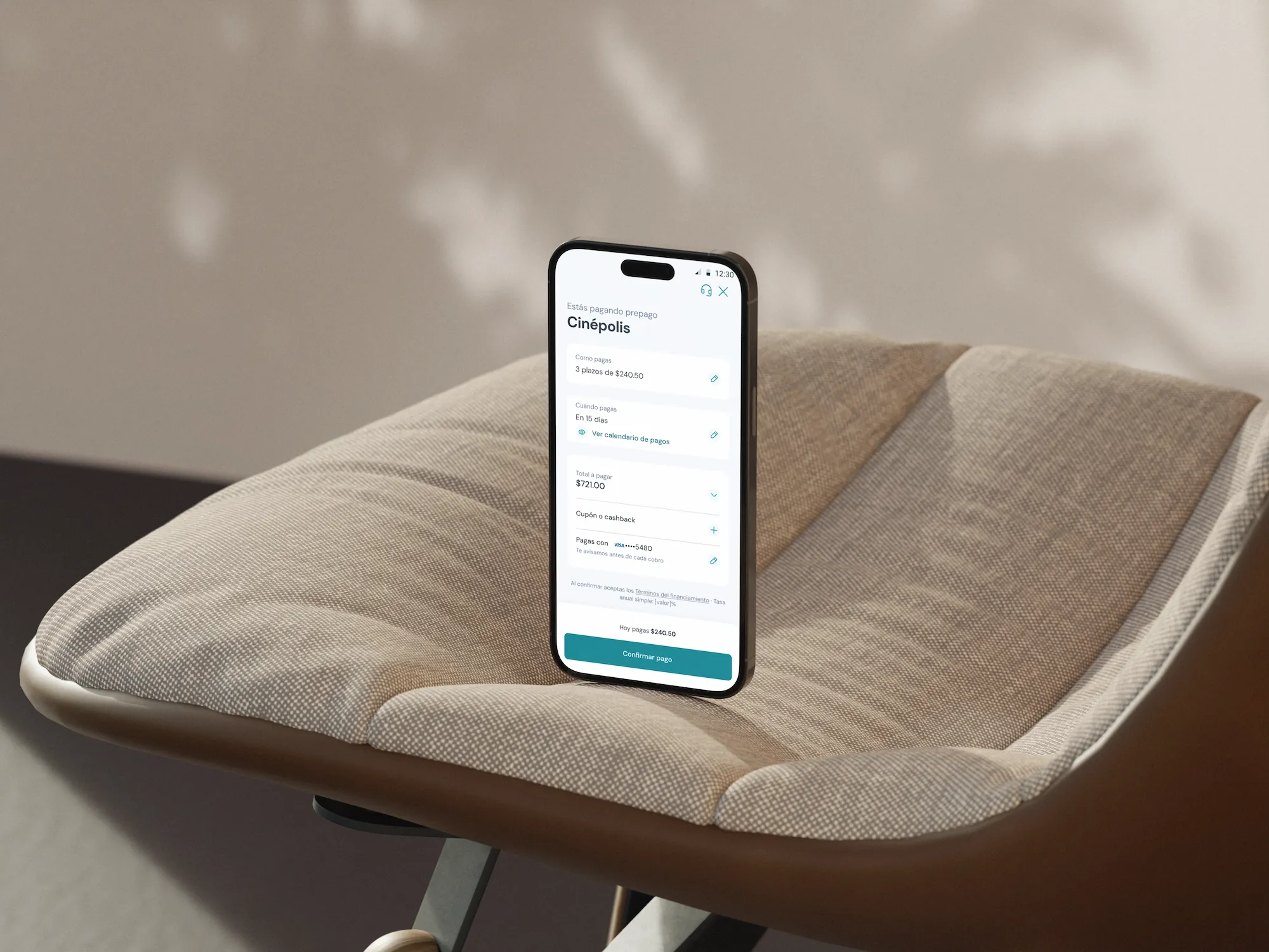 Aplazo credit checkout on a phone resting on a chair